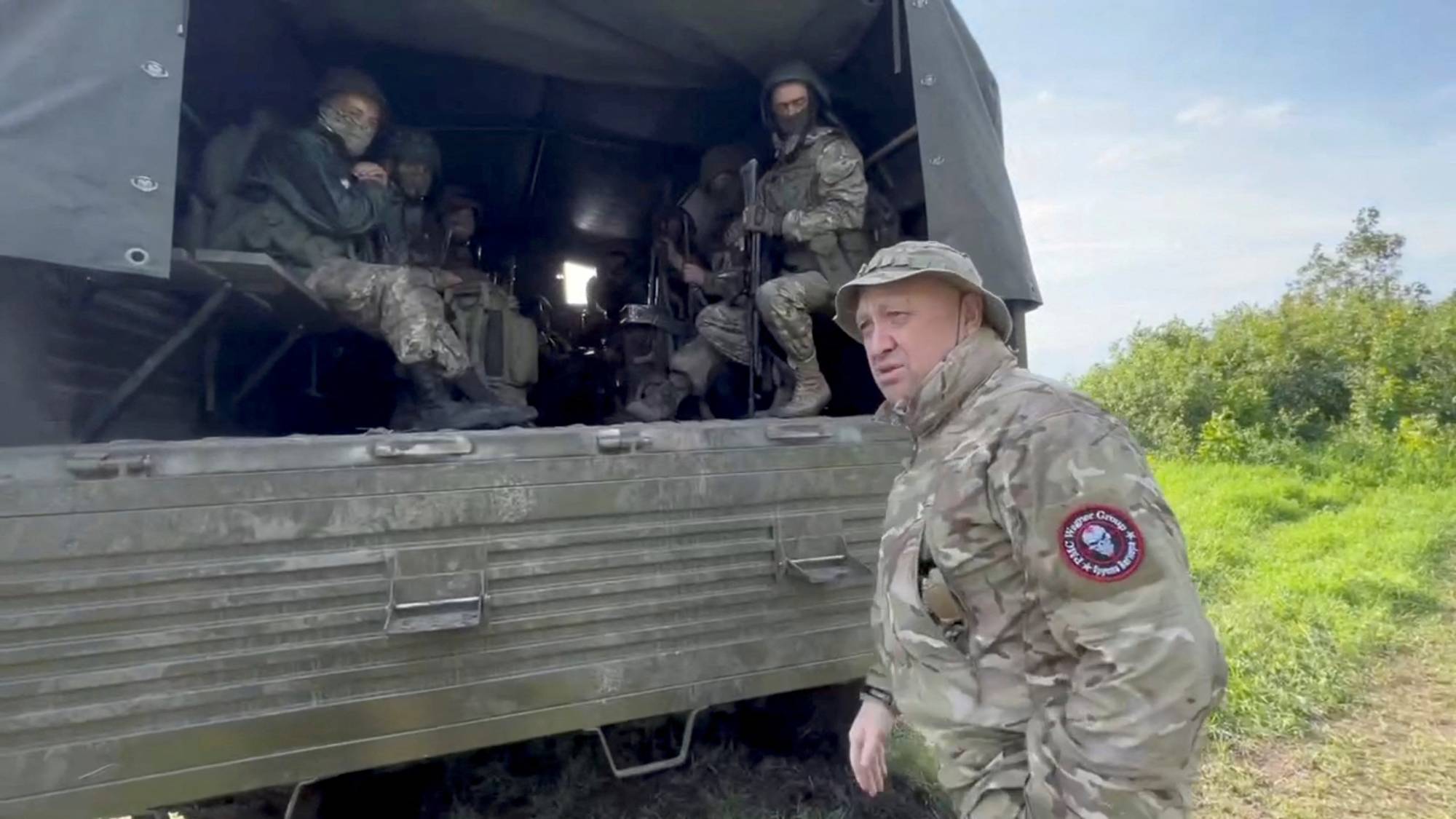 Yevgeny Prigozhin, the founder of the Wagner private mercenary group, speaks with servicemen during the withdrawal of his forces from Bakhmut, Ukraine, earlier this year. | Concord / via REUTERS