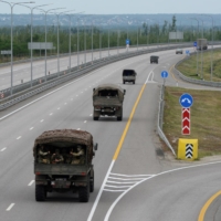 A military column of Wagner Group vehicles along a Russian highway Saturday. | REUTERS