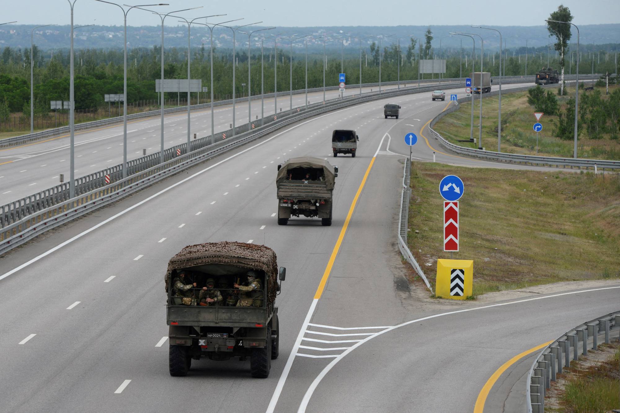 A military column of Wagner Group vehicles along a Russian highway Saturday. | Reuters