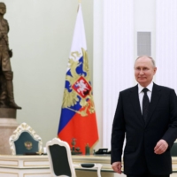 Russian President Vladimir Putin attends a meeting in Moscow on Thursday.  | SPUTNIK / VIA AFP-JIJI