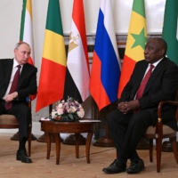 Russian President Vladimir Putin and South African President Cyril Ramaphosa hold talks in St. Petersburg, Russia, on June 17.  | RIA NOVOSTI / VIA REUTERS