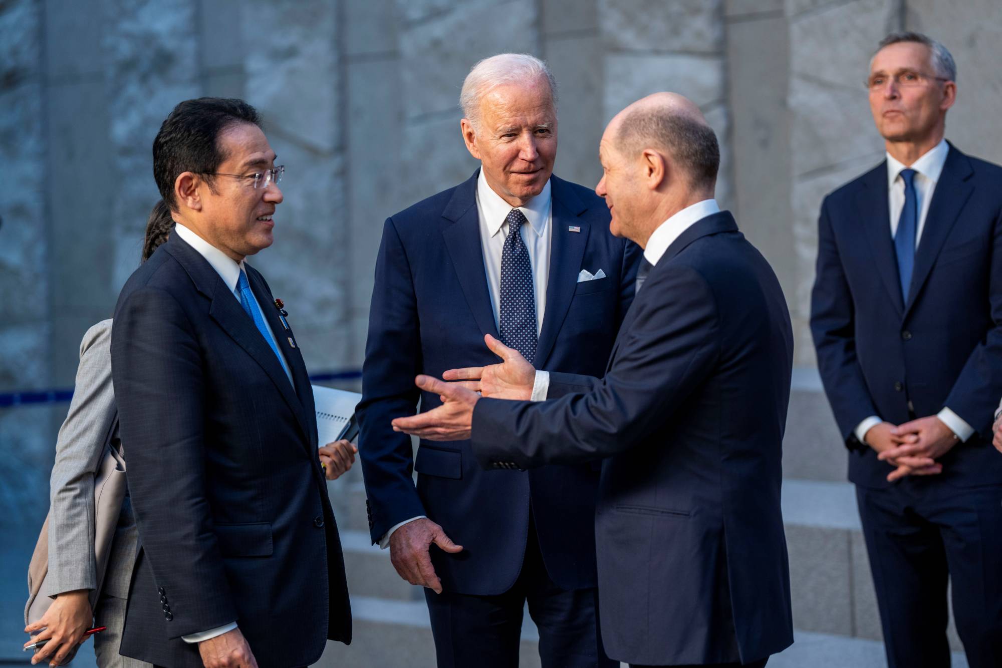 Prime Minister Fumio Kishida meets with U.S. President Joe Biden and German Chancellor Olaf Scholz at NATO Headquarters in Brussels in March 2022.  | POOL / VIA REUTERS