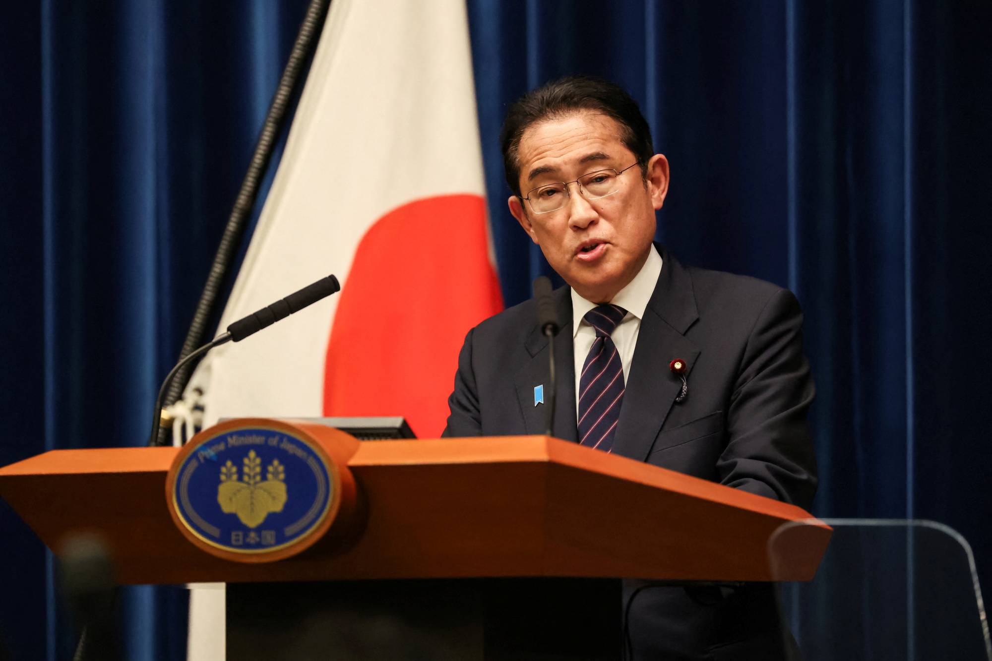 Prime Minister Fumio Kishida speaks during a news conference in Tokyo on Wednesday. | POOL / VIA REUTERS