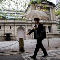 The Bank of Japan has held more than half of the government’s debt for three straight quarters. | REUTERS