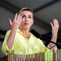 Danish Prime Minister Mette Frederiksen delivers a speech in Allinge, Denmark, on June 16. | RITZAU SCANPIX / IDA MARIE ODGAARD / VIA REUTERS