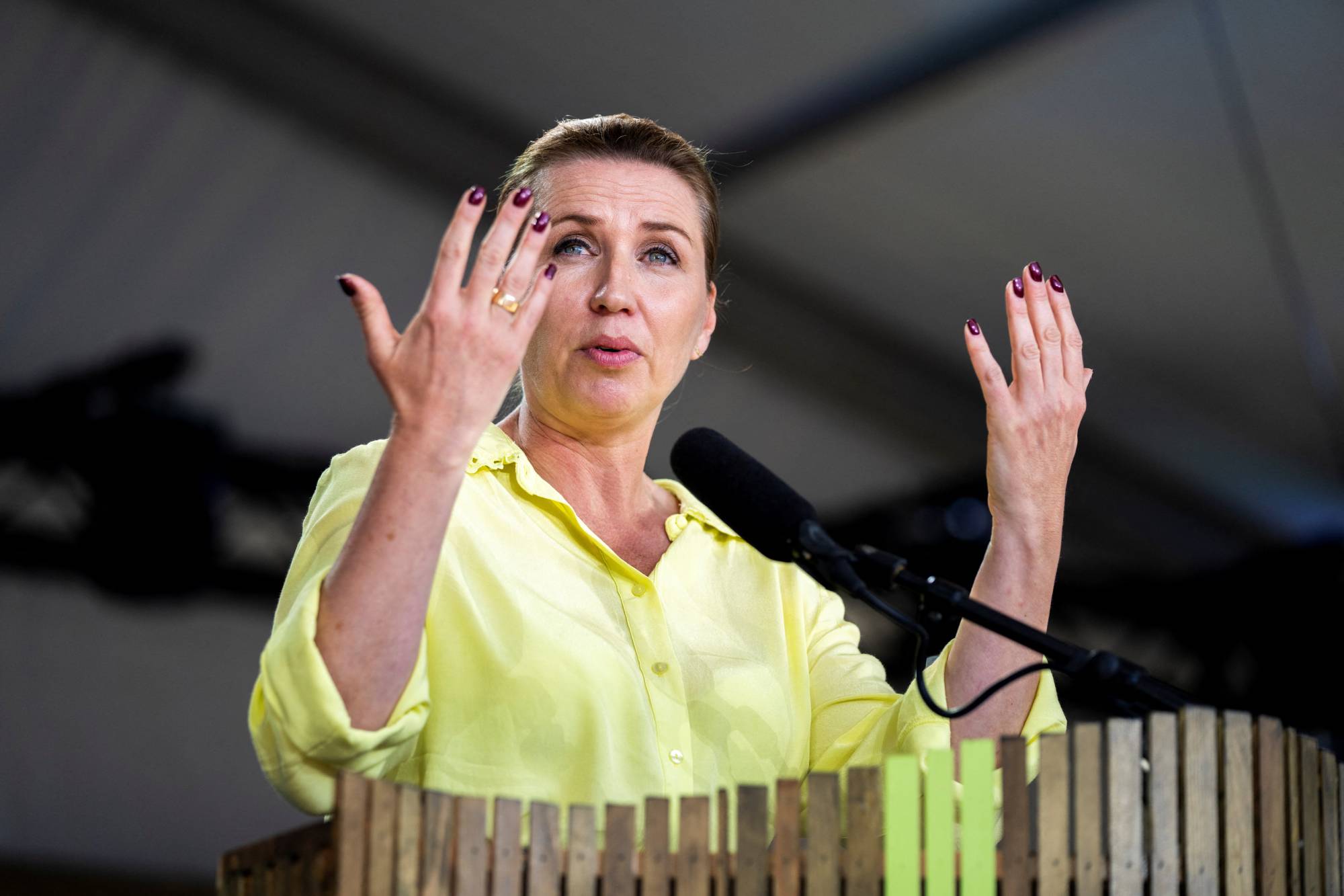 Danish Prime Minister Mette Frederiksen delivers a speech in Allinge, Denmark, on June 16. | Ritzau Scanpix / Ida Marie Odgaard / via REUTERS