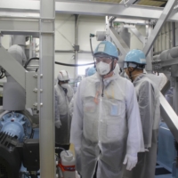 The International Atomic Energy Agency\'s inspection team visits a facility related to treated radioactive water at the Fukushima No. 1 nuclear power plant in Fukushima Prefecture on June 2. | TOKYO ELECTRIC POWER COMPANY HOLDINGS / VIA KYODO
