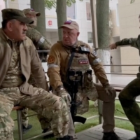 Wagner leader Yevgeny Prigozhin speaks with Russian officers and officials inside the headquarters of Russia\'s southern military district in the city of Rostov-on-Don on Saturday. | TELEGRAM / VIA AFP-JIJI