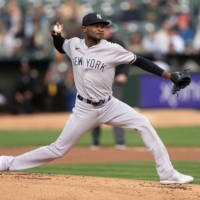 Yankees starter Domingo German pitches against the A\'s during the first inning at Oakland Coliseum in Oakland, California, on Wednesday. | USA TODAY / VIA REUTERS 
