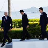 U.S. President Joe Biden, Prime Minister Fumio Kishida and South Korean leader Yoon Suk-yeol wrap up a trilateral meeting on the sidelines of the Group of Seven summit in Hiroshima on May 21. | REUTERS