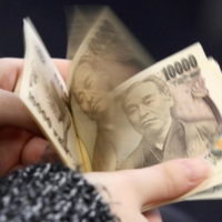 A large factor in foreign investors\' interest is the weakening of the yen, with some drawing parallels to the start of former Prime Minister Shinzo Abe’s signature economic policies in around 2012 and 2013. | REUTERS