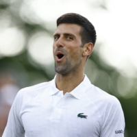 Novak Djokovic celebrates after defeating Frances Tiafoe in an exhibition match in London on June 29. | REUTERS