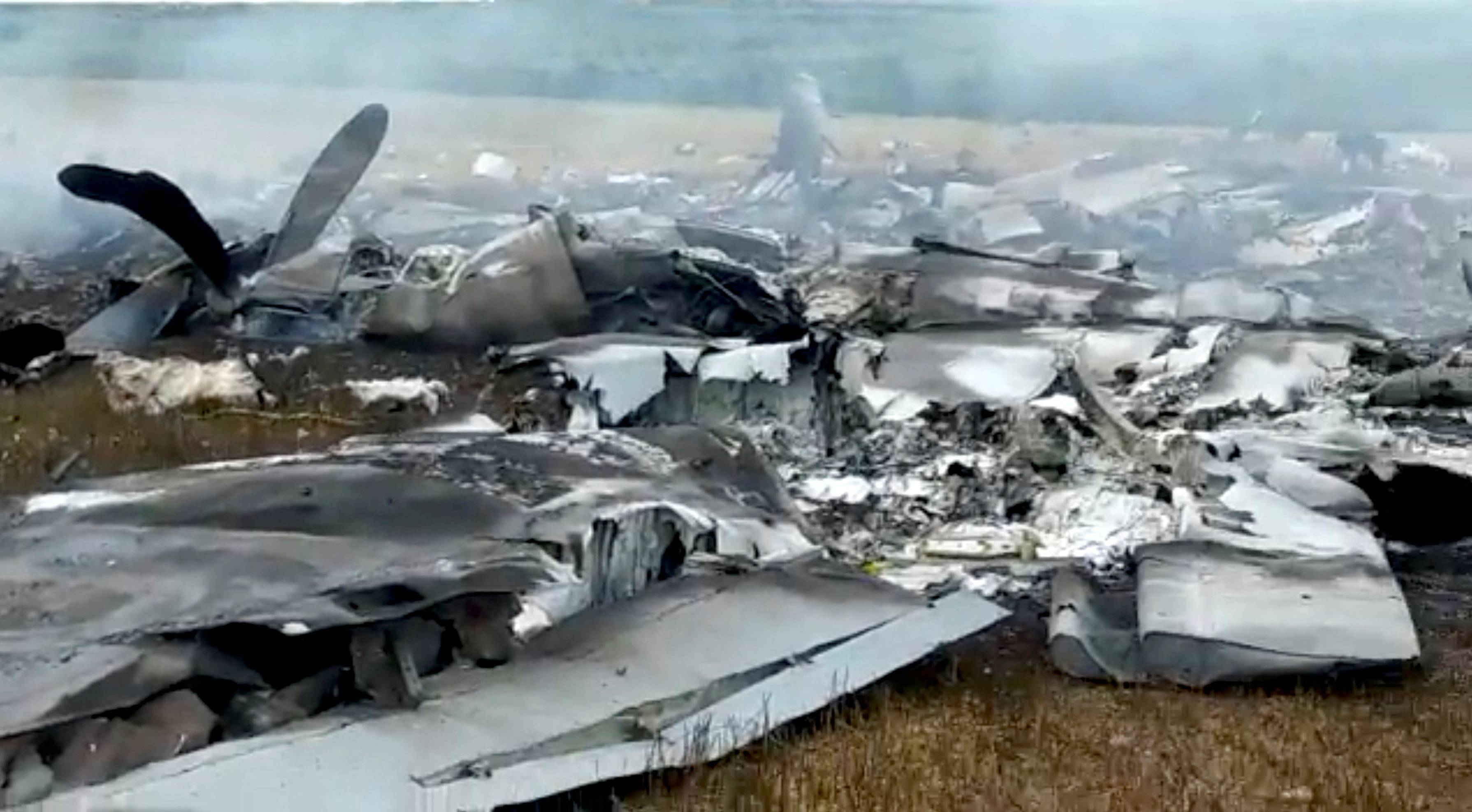 Debris of a downed Russian military plane, purportedly shot down by Wagner troops, in a field near Bugaevka, Russia, on June 24, in this screengrab obtained from a social media video. | via Reuters