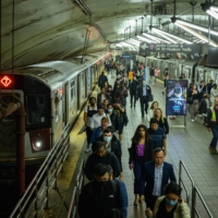 Subway train passengers disembark at Grand Central Terminal in New York City in late May. | AFP-JIJI