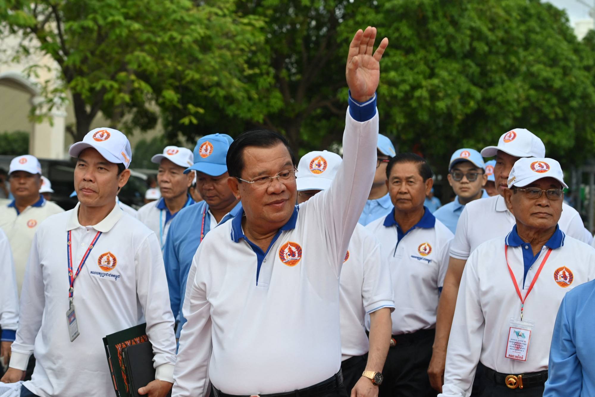 Cambodian Prime Minister Hun Sen waves to supporters during a campaign rally in Phnom Penh on Saturday | AFP-JIJI