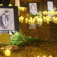 Images of demonstrators who died in Hong Kong during a wave of protests in 2019 are displayed in Taipei on Saturday.  | DANIEL TRAYLOR  
