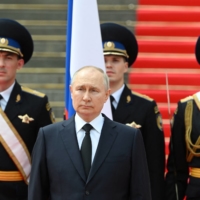 Russian President Vladimir Putin addresses members of the military in Moscow on Tuesday to pay honor to those his government credits with upholding order during the recent mutiny. | SPUTNIK / POOL / VIA REUTERS