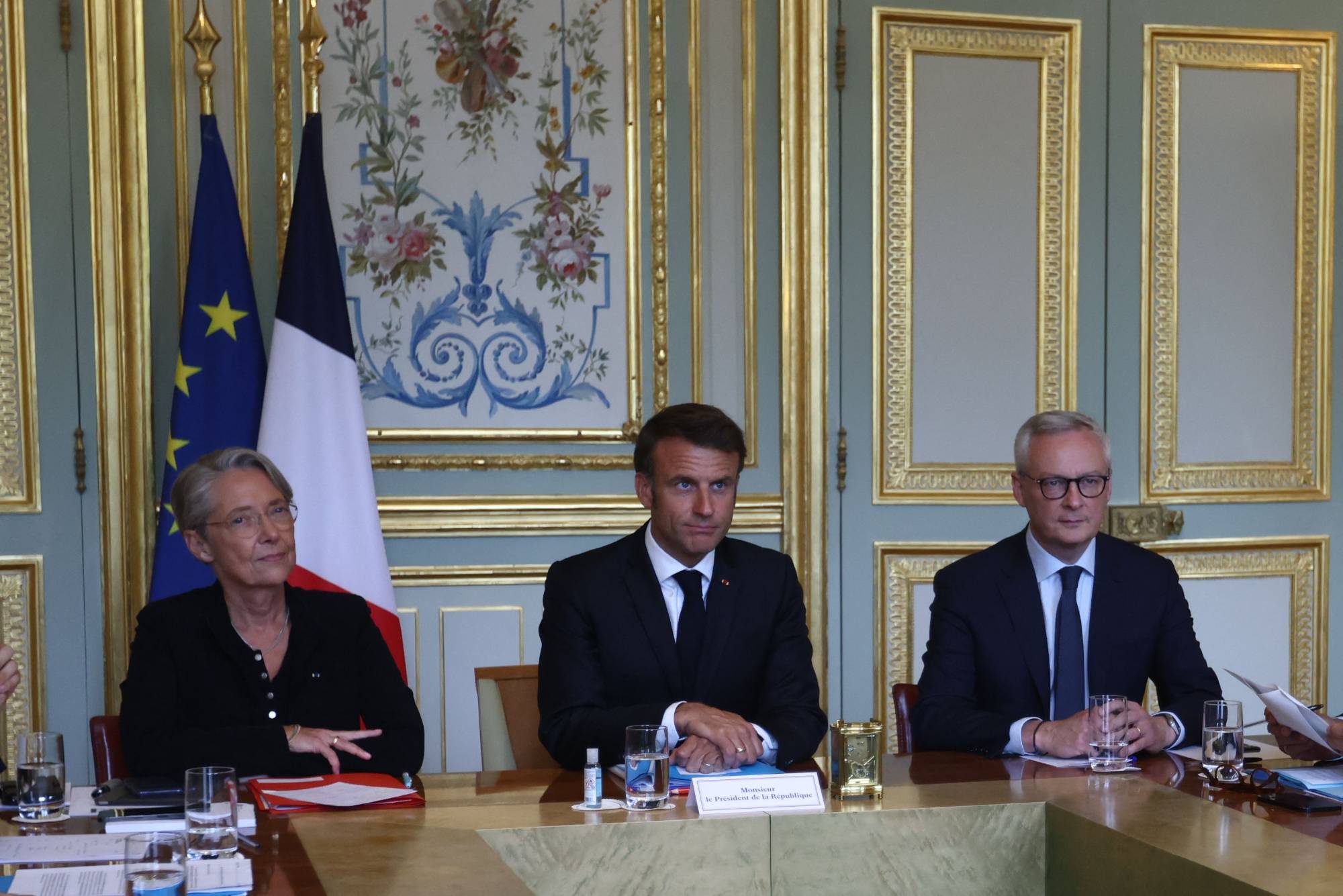 French President Emmanuel Macron attends an emergency government meeting in Paris on Sunday after riots erupted for a fifth night in a row. | Pool / via AFP-Jiji