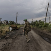 A Ukrainian soldier in Neskuchne, Ukraine, which was recently taken back from Russian forces by Ukraine’s 129th Territorial Defense Brigade. | DAVID GUTTENFELDER / THE NEW YORK TIMES