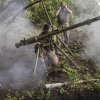 Ukrainian soldiers with the 68th Brigade fire a SPG-9 recoilless gun toward Russian positions near Prechystivka in the Donetsk region of Ukraine. | DAVID GUTTENFELDER / THE NEW YORK TIMES