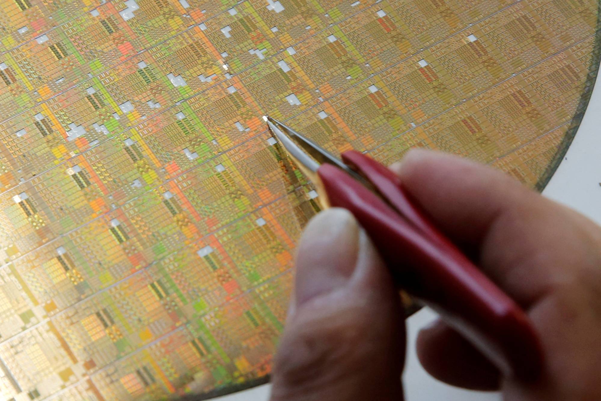 A semiconductor wafer at a research center in Beijing. China plans to limit the export of its gallium and germanium, metals used to make chips, electric cars and telecommunications equipment. | REUTERS