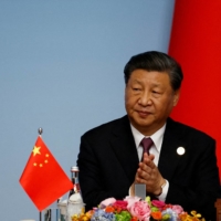 Chinese President Xi Jinping applauds at a joint news conference for the China-Central Asia Summit in Xi\'an, in China\'s Shaanxi province, on May 19. | POOL / VIA REUTERS