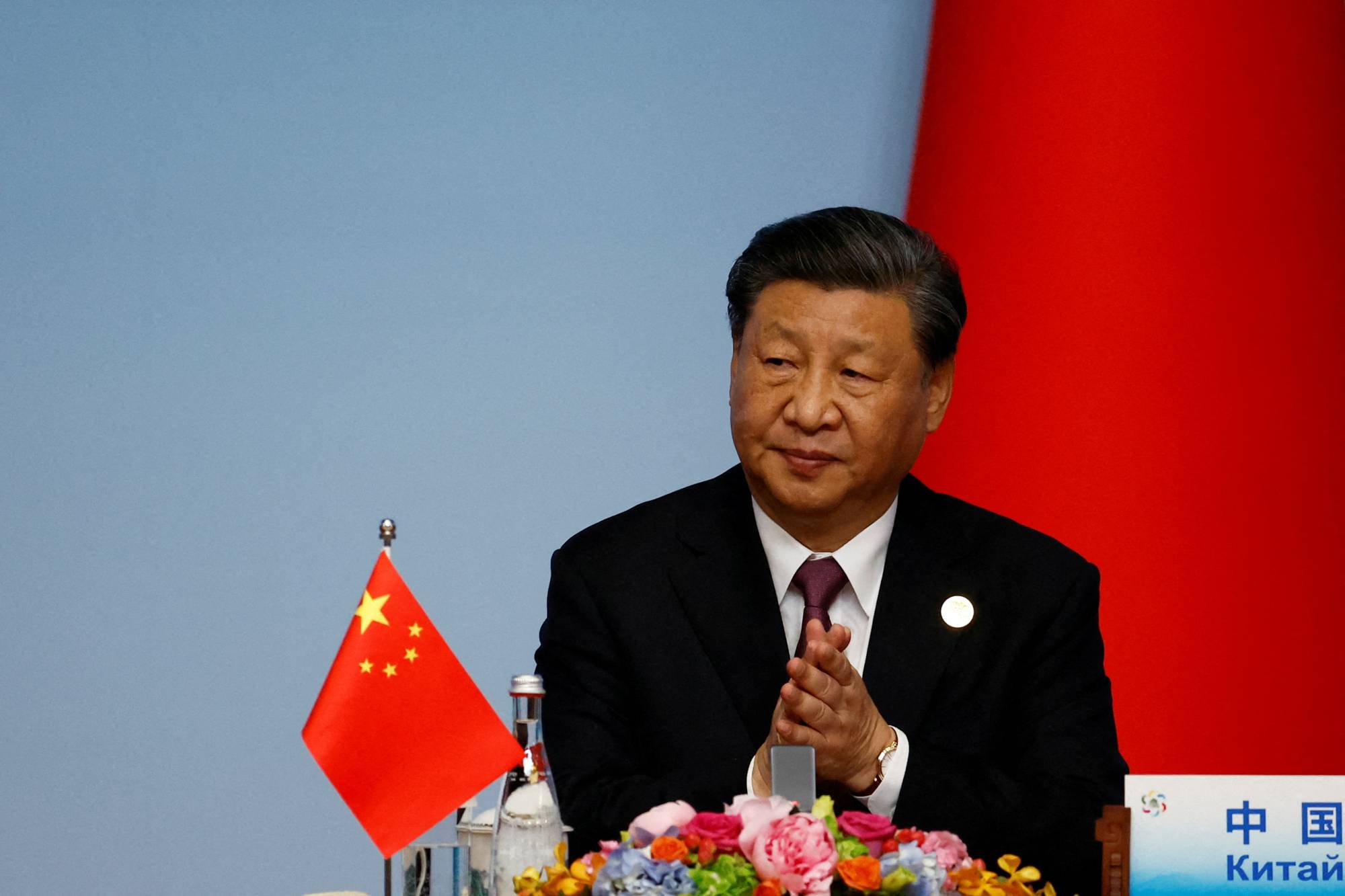 Chinese President Xi Jinping applauds at a joint news conference for the China-Central Asia Summit in Xi'an, in China's Shaanxi province, on May 19. | POOL / VIA REUTERS