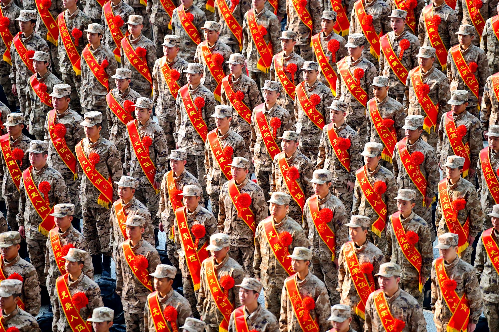 New People's Liberation Army recruits attend a send-off ceremony at a railway station in Ganzhou, in China's Jiangxi province, on March 16. The PLA has, in recent years, discussed the need to become an agenda-setter in global security and a leader in the global security discourse. | China Daily / via REUTERS