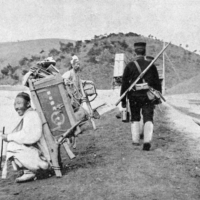 A Japanese soldier walks by civilians during the Russo-Japanese War. | H. W. WILSON, JAPAN’S FIGHT  FOR FREEDOM [LONDON: AMALGAMATED PRESS, 1904–1906], 1:300