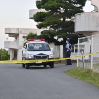 A police car is parked outside Wakayanagi Elementary School in the city of Kurihara, Miyagi Prefecture, on Thursday after a man drove a truck onto the school premises, injuring four children. | KYODO