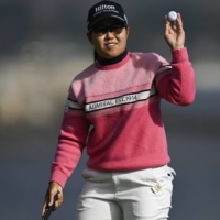 U.S. Women\'s Open leader Nasa Hataoka picks up her ball after completing the 18th hole at Pebble Beach Golf Links in Pebble Beach, California, on Saturday. | USA TODAY / VIA REUTERS