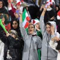 Fans cheer during Iran\'s friendly against Russia in Tehran on March 23. | MAJID ASGARIPOUR/ WEST ASIA NEWS AGENCY / VIA REUTERS 