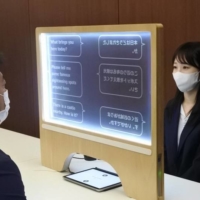 A big draw for the Voice Biz UCDisplay is the transparent interface, which allows users to look at each other\'s faces as they talk to one another. | SEIBU RAILWAY

