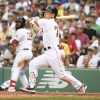 Red Sox designated hitter Masataka Yoshida connects on a home run against the Athletics during the eighth inning at Fenway Park in Boston on Sunday. | USA TODAY / VIA REUTERS