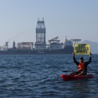 A Greenpeace activist protests against a deep-sea mining vessel in the Clarion-Clipperton Zone between Mexico and Hawaii, in November 2022. | REUTERS