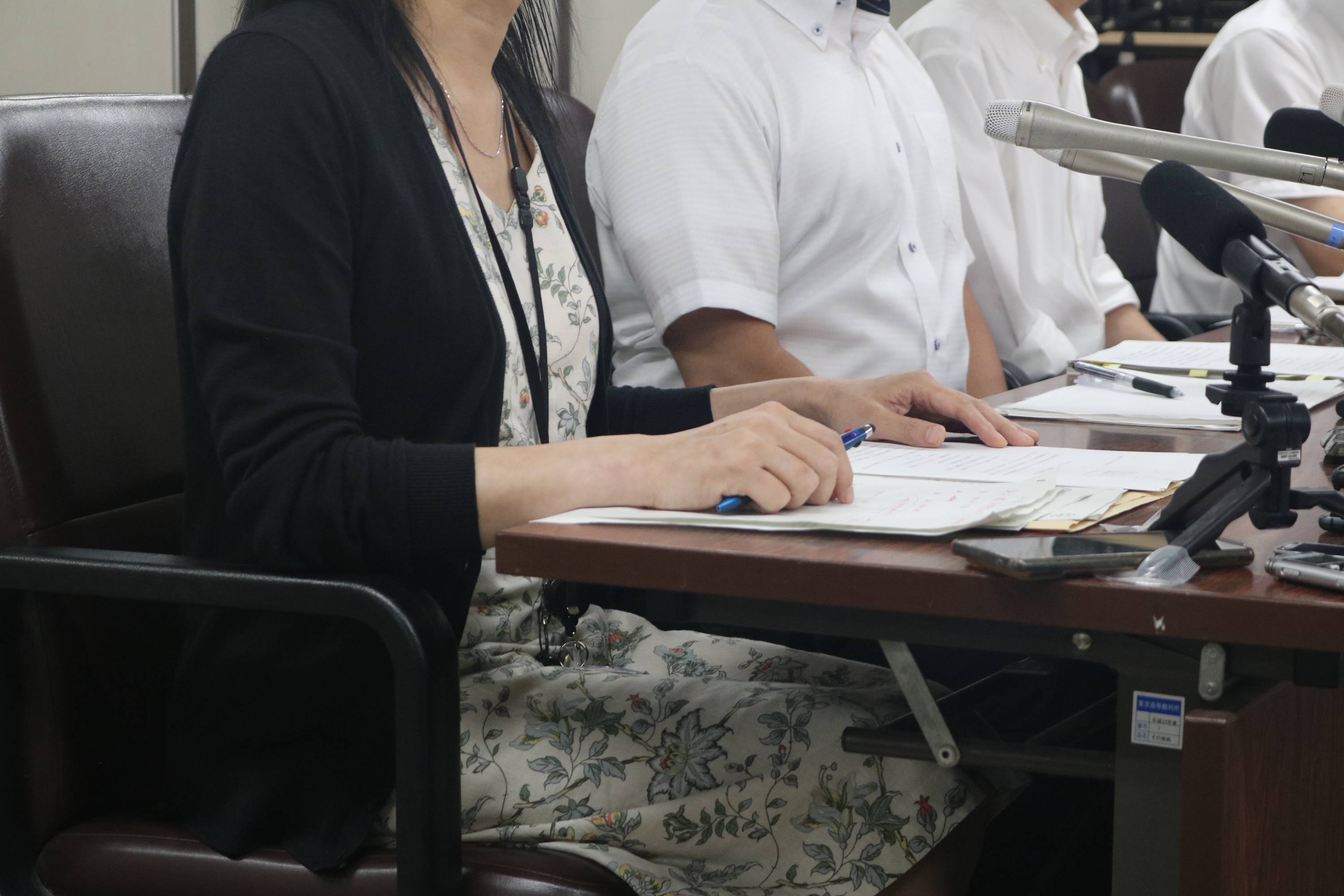 A transgender woman speaks at a news conference alongside her lawyers in Tokyo on Tuesday after a Supreme Court ruling that said it was unlawful to restrict her use of bathrooms at her workplace. | JADENNE RADOC CABAHUG