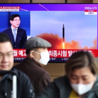 People watch a TV broadcasting a news report about a North Korean launch of a ballistic missile at a railway station in Seoul in April. The North on Wednesday launched another apparent ballistic missile, Japan\'s Defense Ministry said. | REUTERS