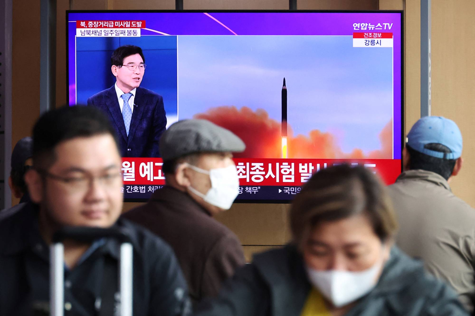 People watch a TV broadcasting a news report about a North Korean launch of a ballistic missile at a railway station in Seoul in April. The North on Wednesday launched another apparent ballistic missile, Japan's Defense Ministry said. | REUTERS