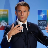 French President Emmanuel Macron gives a news conference during the NATO summit in Vilnius, Lithuania, on Wednesday. | AFP-JIJI