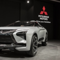 A Mitsubishi Motors e-Evolution concept sports utility vehicle is displayed at the Beijing International Automotive Exhibition in Beijing in April 2018. The company\'s annual China sales peaked in 2019. | BLOOMBERG