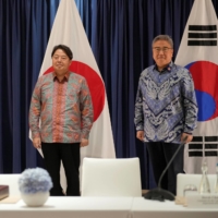 U.S. Secretary of State Antony Blinken, South Korean Foreign Minister Park Jin and Foreign Minister Yoshimasa Hayashi pose for a photo during their meeting in Jakarta on Friday. | POOL / VIA REUTERS