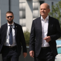German Chancellor Olaf Scholz arrives at a summer news conference on domestic policy and diplomacy in Berlin on Friday.  | AFP-JIJI