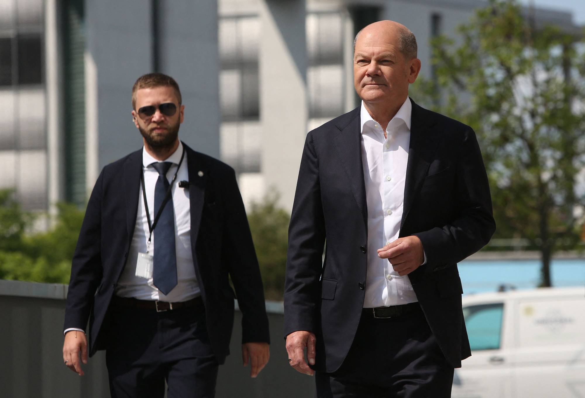 German Chancellor Olaf Scholz arrives at a summer news conference on domestic policy and diplomacy in Berlin on Friday.  | AFP-JIJI