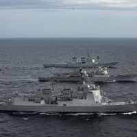 Japanese, South Korean and U.S. naval destroyers hold a rare joint missile defense exercise Sunday in the Sea of Japan. | JAPAN DEFENSE MINISTRY JOINT STAFF OFFICE