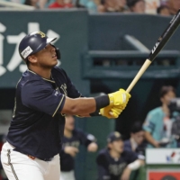 Buffaloes designated hitter Leandro Cedeno connects on a three-run home run against the Hawks in the sixth inning in Fukuoka on Monday. | KYODO
