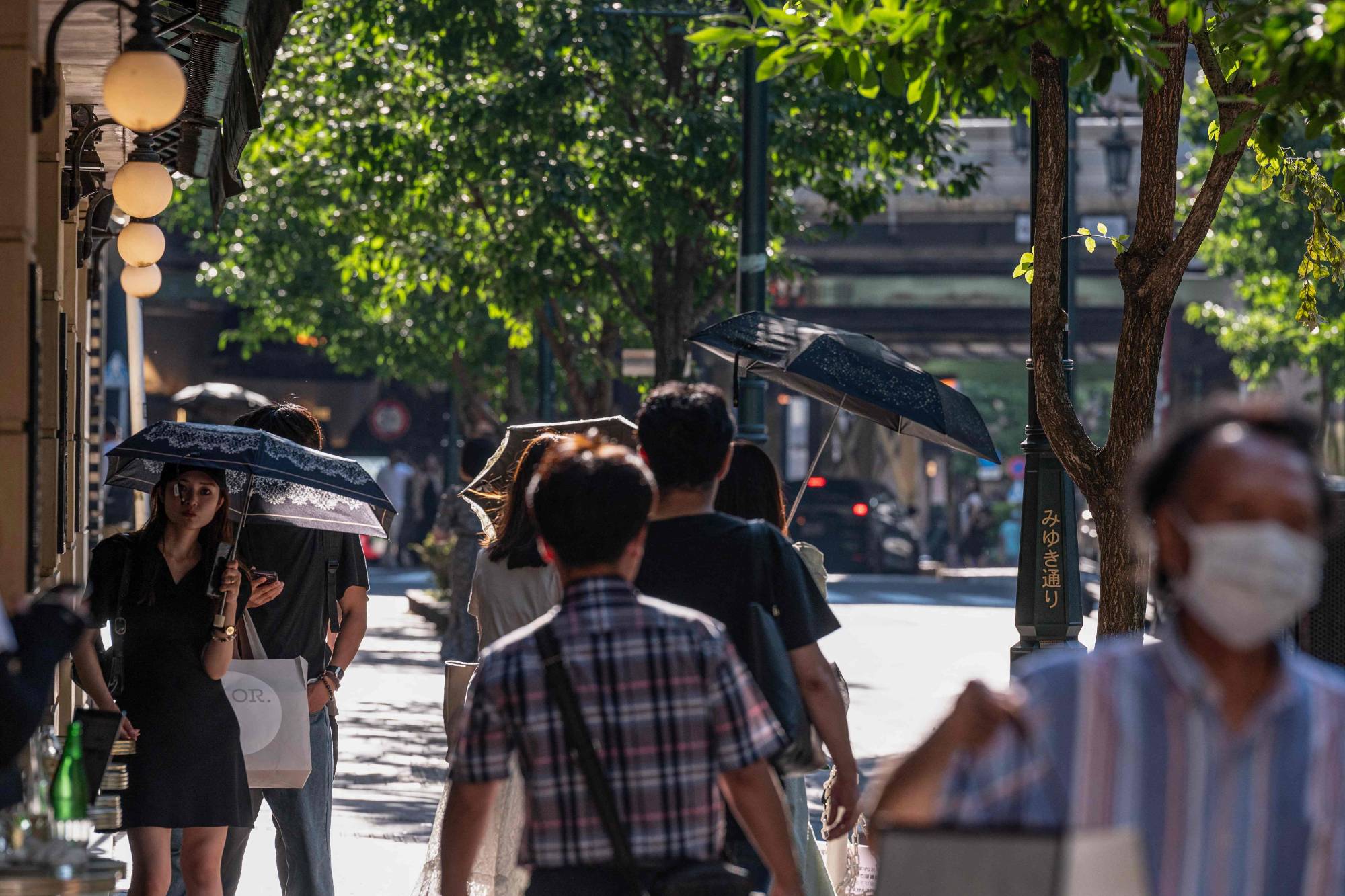 A street in Tokyo on Monday. The number of new hospital admissions for COVID-19 is rising, standing at 6,096 in the week through July 9 — up from 5,494 a week before. | AFP-JIJI