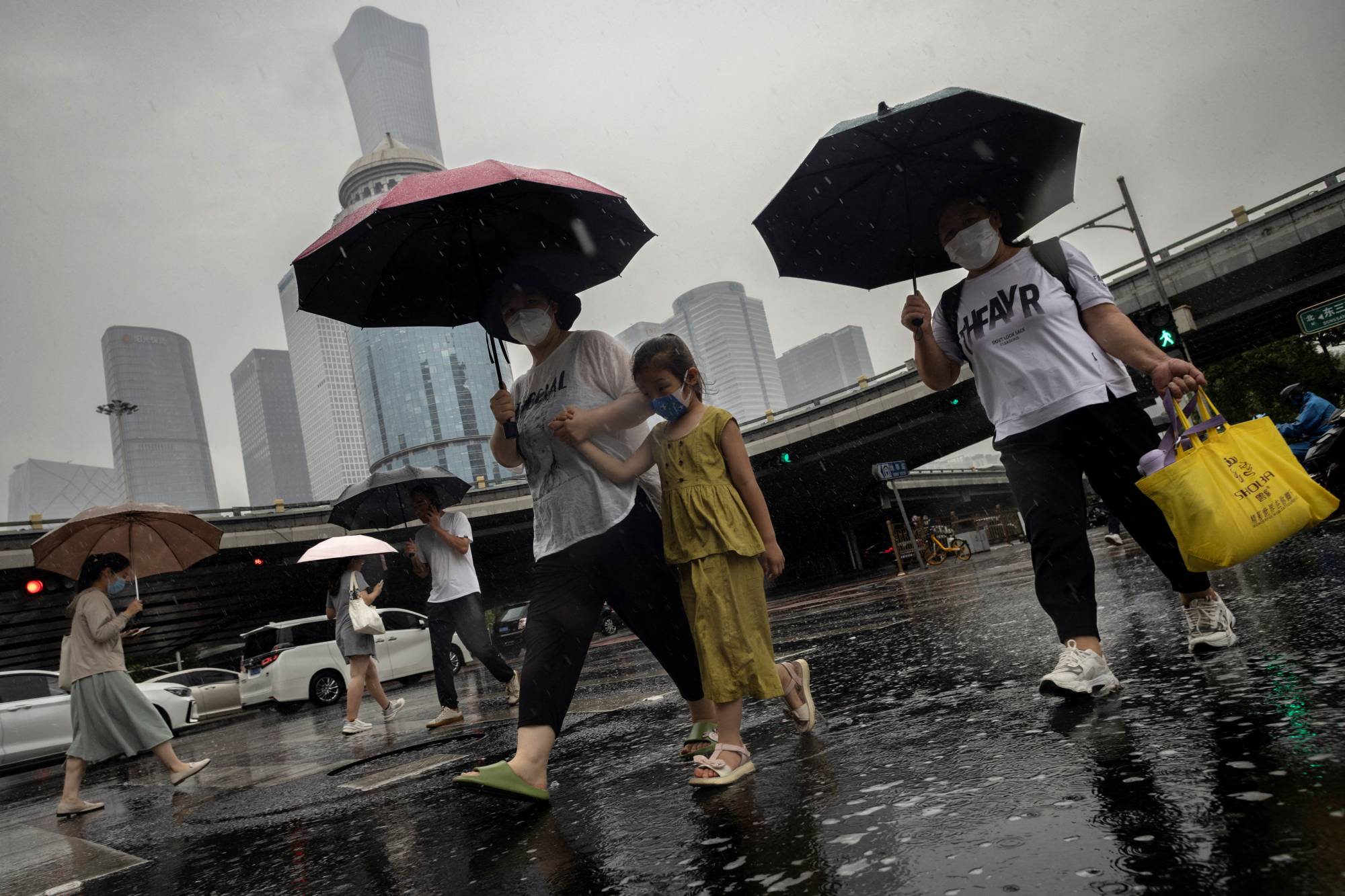 The Central Business District on a rainy day in Beijing. Both U.S. and European companies with exposure to China could be hit by its sluggish growth as its post-COVID-19 momentum has faltered rapidly. | REUTERS