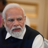 Indian Prime Minister Narendra Modi speaks during an event in Paris on July 14. | POOL / VIA REUTERS