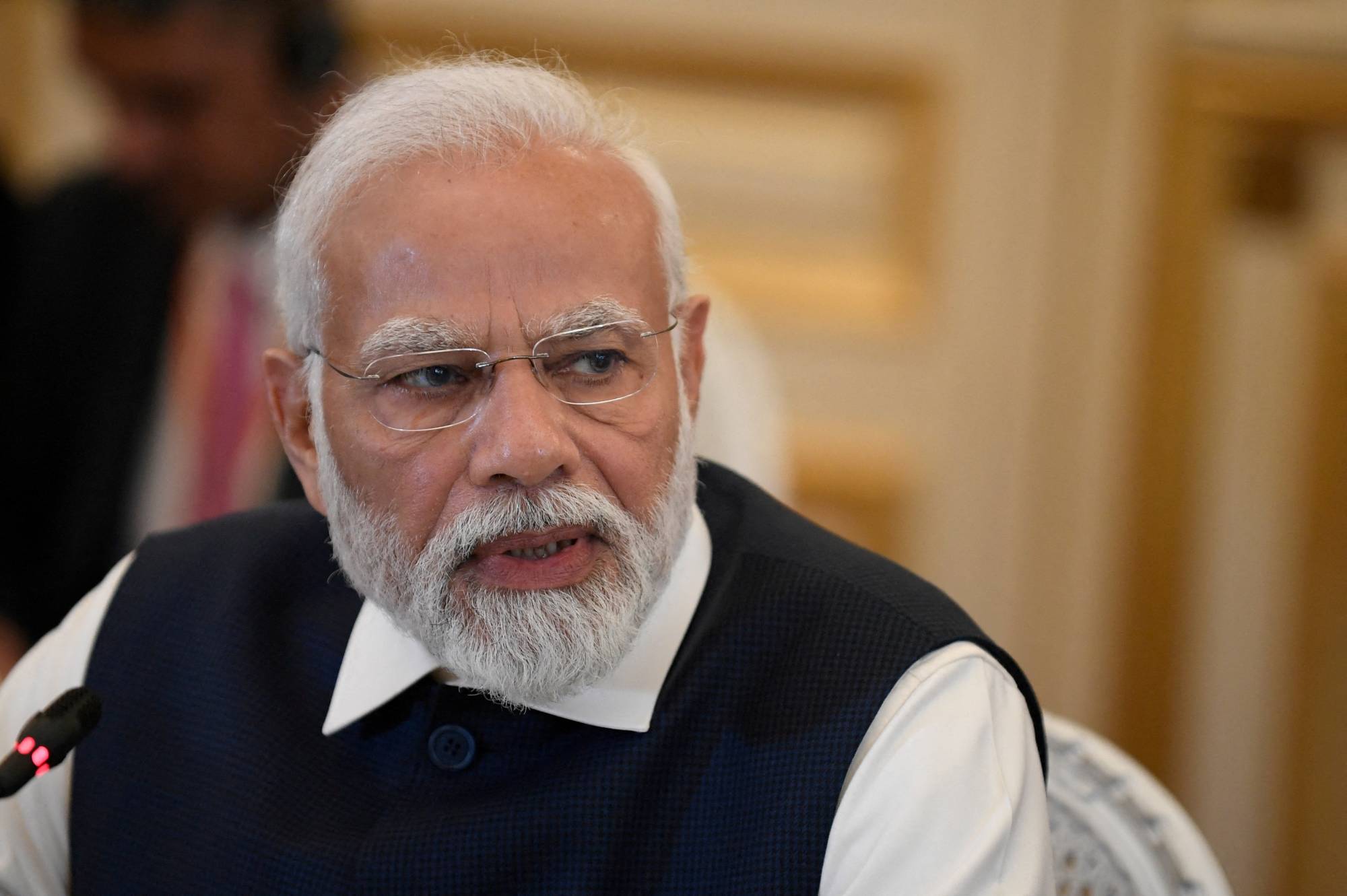 Indian Prime Minister Narendra Modi speaks during an event in Paris on July 14. | Pool / via REUTERS