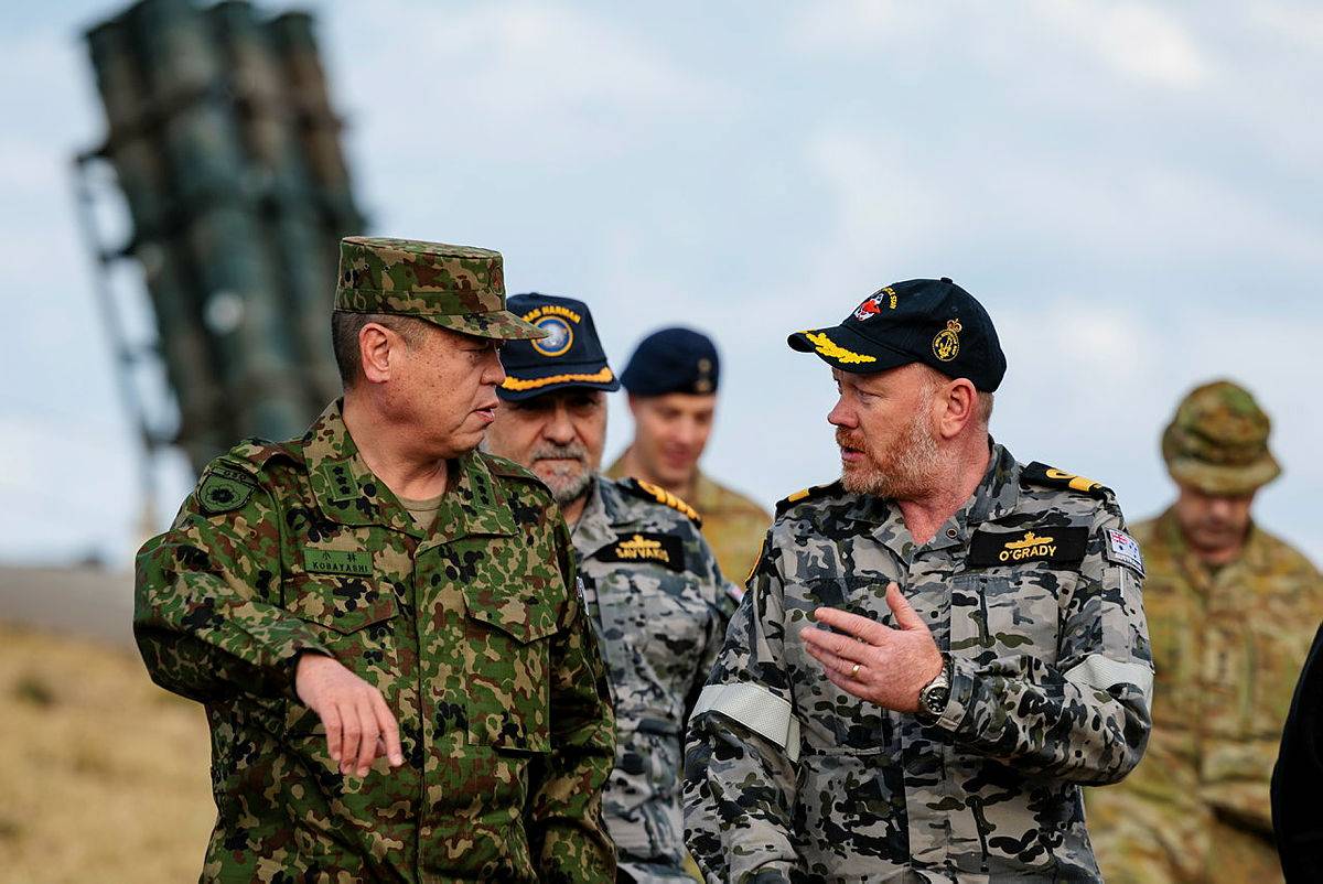 Lt. Gen. Hiroki Kobayashi, vice chief of staff of the Ground Self-Defense Force, speaks with Australian Commodore Paul O’Grady at the Beecroft Weapons Range, in Australia's New South Wales, on Thursday in the lead up to Exercise Talisman Sabre. | AUSTRALIAN DEFENCE FORCE